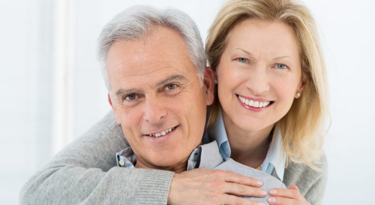 Portrait Of Happy Senior Couple Smiling at Home