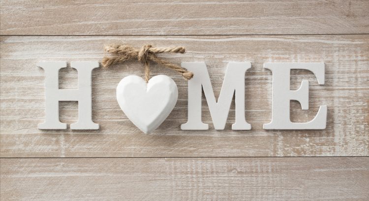 Home sweet home, wooden text on vintage board background with copy space